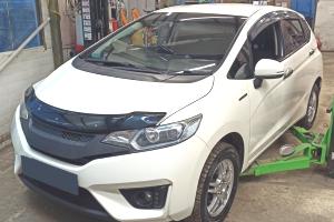 Хонда Фит в автотехцентре на замене рулевых наконечников